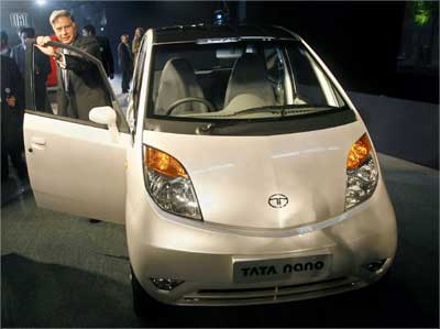 Tata Group Chairman Ratan Tata Poses With The Nano